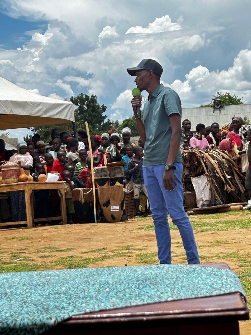 DigniRise team member addressing the community outdoors